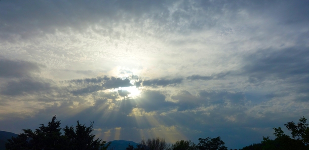Todays sky seems to come out of a religious painting with the suns rays piercing the clouds