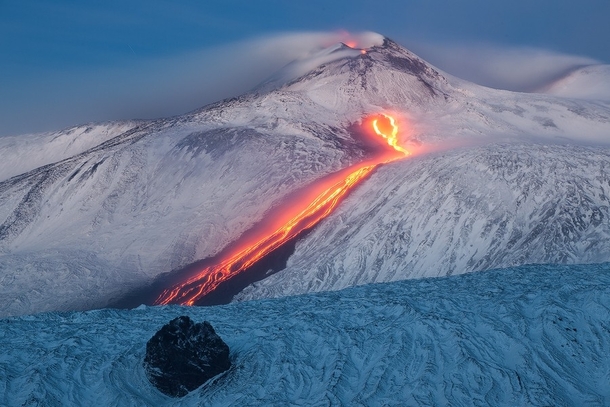 Tongue of Fire - lava streaming down the snowy sides of Mount Etna Italy  by Dreamerlandscapecom