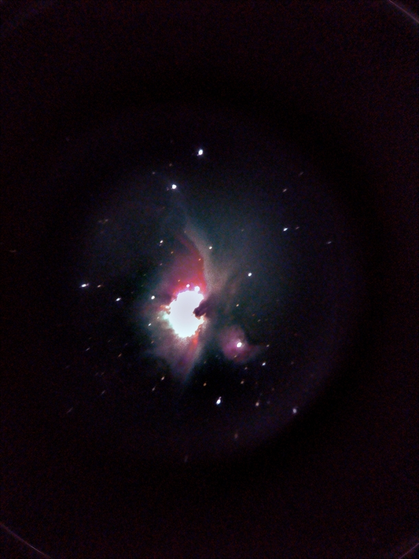 Took  pics of the Orion nebula with a smartphone and an untracked telescope and stacked them Not great at all but this is my first ever astrophotography attempt and Im proud