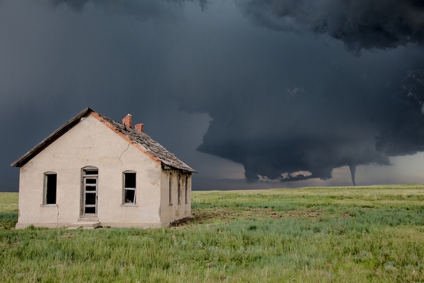 Tornado touches down behind this abandoned homestead on the Colorado Palmer Divide on June   Eric Hurst 