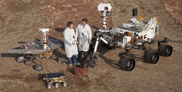 Two engineers stand with the three generations of Mars rovers developed at NASAs Jet Propulsion Laboratory  xpost rTechnologyPorn