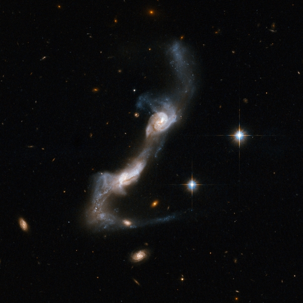 UGC  - a strongly interacting pair of spiral galaxies resembling two ice skaters 