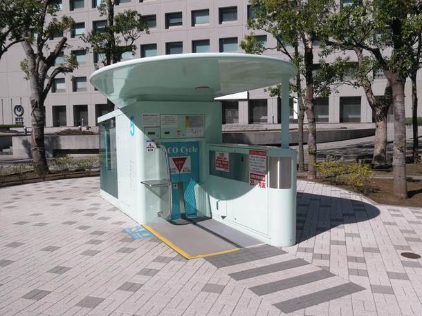 Undeground bicycle parking system in Tokyo Japan You place your bike on the platform and it places it on a rack underground
