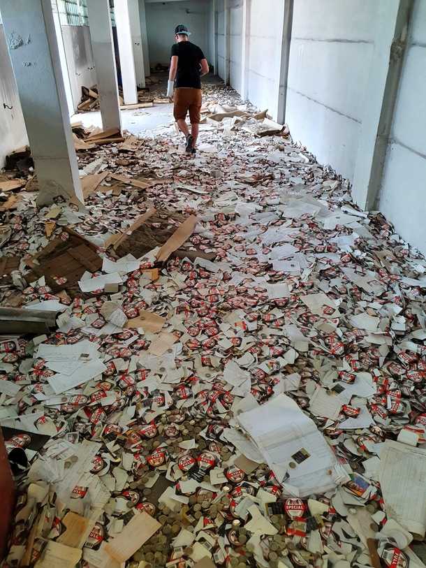 Untouched bootle caps beer labels and invoices full of unsecured customer data on the floor of a brewery closed in  in Brzeg Poland 