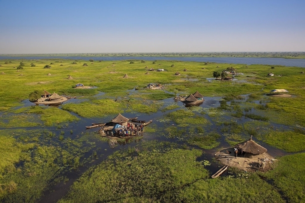 Village in the swamps of the White Nile South Sudan  Photo by Yann Arthus Bertrand