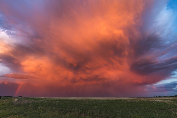 Vivid colours of sunset hitting a storm cell on the Saskatchewan prairie 
