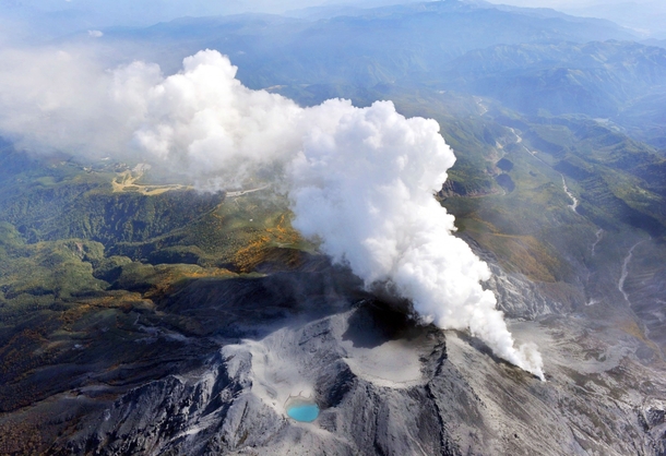 Volcanic gases and ash billow from the peak crater of Mount Ontake in central Japan  Photo by Kyodo News via AP