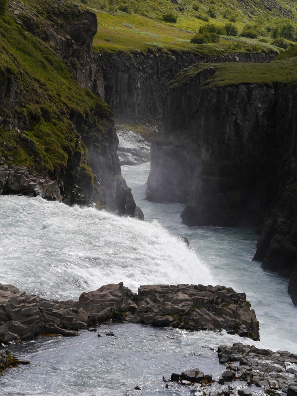 Water going over the edge of Gullfoss into the canyon below Iceland 