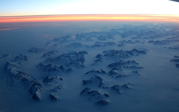 Where Greenland meets the frozen ocean at sunset Lucky view on a flight between Iceland and Canada 
