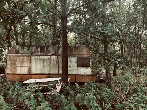 Whilst Having a walk deep in the woods in Somerset UK I came across this old abandoned caravan covered in moss It looks as if it was from the s It was quite unexpected and creeped me out a bit  