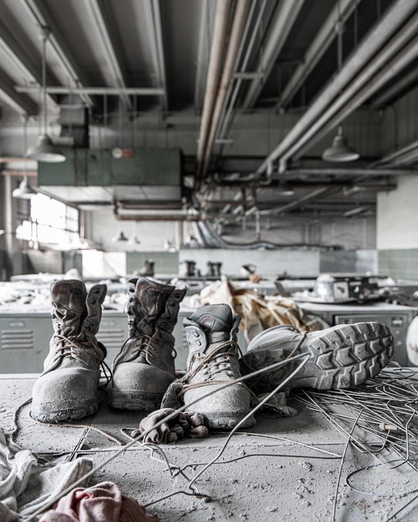 Workers shoes left on top of lockers in a factory locker room in Prypiat Ukraine 
