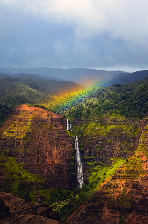 Yesterday a rainbow appeared over a hanging waterfall for about  minutes in Waimea Canyon Kauai HI 