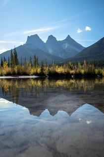  Policemans Creek reflection pond of the Three Sisters Mountains located in Canmore Alberta