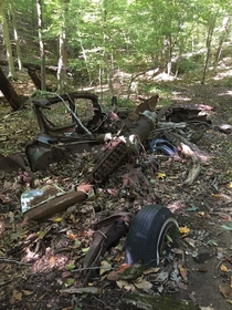  Remnants of an old car in the middle of the woods in Maryland