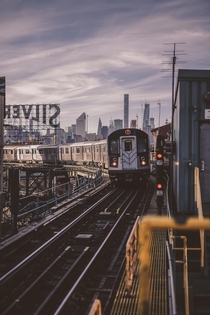  train meandering in front of the Manhattan Skyline - Queens NYC