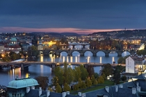 A beautiful sunset in Prague overlooking the Vltava river and the iconic Charles Bridge 