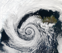 A beautifully-formed low-pressure system swirling off of the southwestern coast of Iceland looks eerily like a spiral galaxy andor a large swirling cloud of hydrogen fragmenting away from a much larger cloud of hydrogen and undergoing gravitational collap