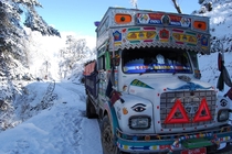 A Bhutanese bus makes it through the snow 