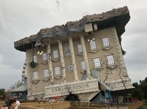A building in South Myrtle Beach SC designed to look like it fell on its head from the sky