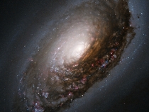 A collision of two galaxies Messier  M has a spectacular dark band of absorbing dust in front of the galaxys bright nucleus giving rise to its nicknames of the Black Eye or Evil Eye galaxy NASAESA and The Hubble Heritage Team 