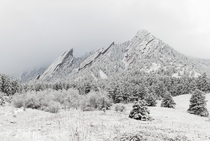 A fresh snow brilliantly coats Boulder Colorados natural pride and joy The Flatirons 