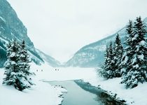 A frozen Lake Louise on a foggy winters day 