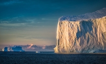 A giant iceberg greeting the sun on an early morning in Eastern Greenland  by hpd-fotografy 