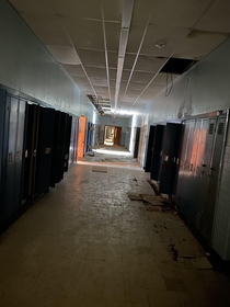 A hallway to an old abandoned school that me and a few friends explored last week very little graffiti all natural decay