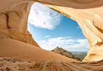 A hidden alcove creating its own sand dune in Southern Utah USA 