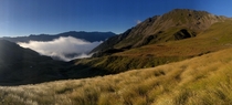A lonely cloud making friends with some peaks Nelson Lakes National Park New Zealand 
