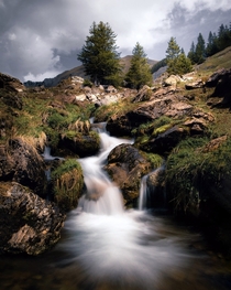 A long exposure of a waterfall in the morning after a nice camping with friends Switzerland Canton of Bern 
