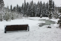 A memorial bench overlooks the Similkameen River in East Gate British Columbia Canada 