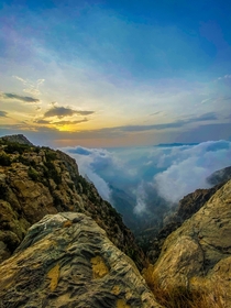A mountain peak that hugs the clouds in Nimas Saudi Arabia 