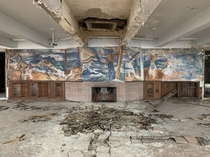 A mural left mostly intact in an abandoned military training facility