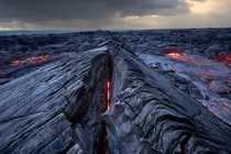 A peek directly into the glowing veins of Klauea the most active of the five volcanoes that together form the island of Hawaii  photo by Jason Matias