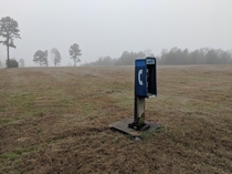 A phone booth in the fog