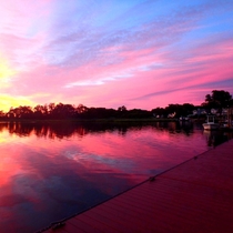A pink sky during sunset  the boat ramp in Rumson NJ