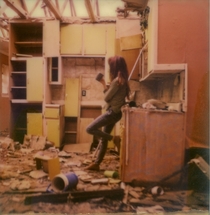 A Polaroid I took of my girlfriend in an abandoned house in her neighborhood with Impossible film 