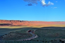 A road cuts through the high desert plains of the canyon lands between Utah and Colorado 