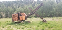 A rusted up abandoned power shovel