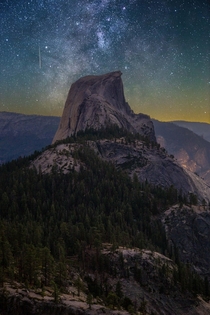 A shooting star amp the Milky Way gleaming over Half Dome Yosemite National Park 