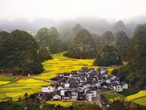 A small village surrounded by the hills of Guizhou Province China 