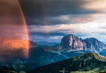 A spectacular evening light show before a storm in the Dolomites 