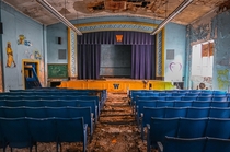 A very colorful abandoned school auditorium