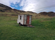 A wooden trailer in the hills of Iceland 