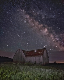 Abandoned barn under the Milky Way