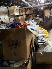 Abandoned basement full of vintage clothing dating back to the s