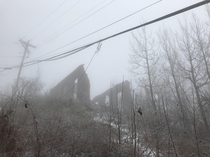 Abandoned building at the top of an incline in the fog- ive been here dozens of times but this is the best picture ive taken of it