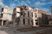Abandoned building sits crumbling just next to The Malecon in Havana Cuba 