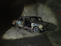 Abandoned car un a disused limestone quarry